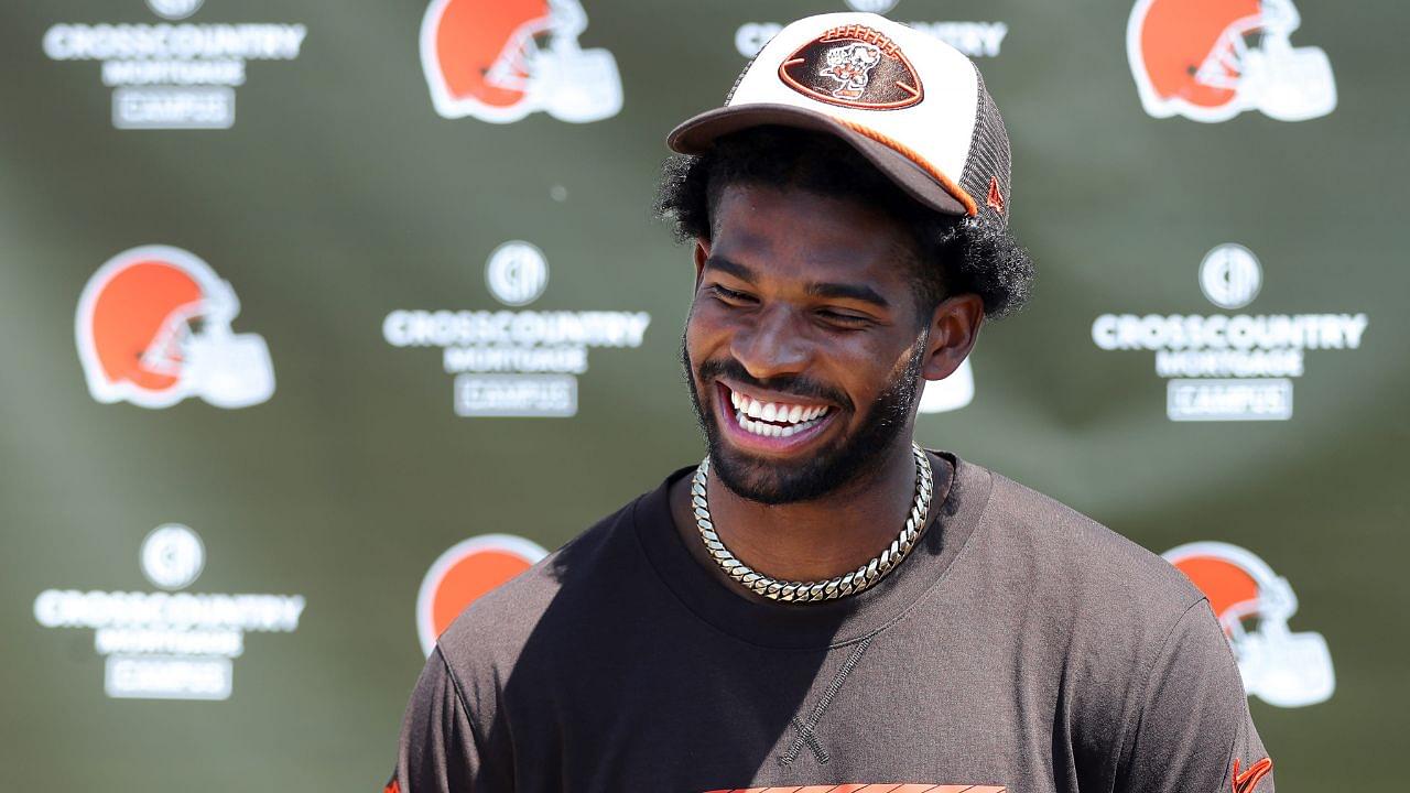 Cleveland Browns quarterback Shedeur Sanders (12) jokes about his signing bonus during a press conference before day two of NFL rookie minicamp at the Cleveland Browns training facility on Saturday, May 10, 2025, in Berea, Ohio.