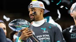 Feb 9, 2025; New Orleans, LA, USA; Philadelphia Eagles quarterback Jalen Hurts (left) and head coach Nick Sirianni celebrate with the Vince Lombardi Trophy after defeating the Kansas City Chiefs during Super Bowl LIX at Ceasars Superdome.