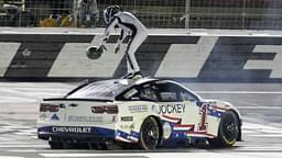 NASCAR Cup Series driver Ross Chastain (1) celebrates his come from behind win with a burnout and tossing a watermelon on the finish line during the Coca Cola 600 at Charlotte Motor Speedway.