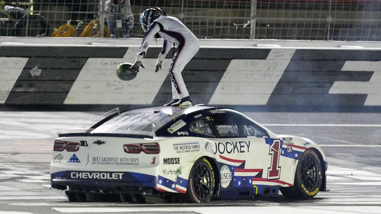 NASCAR Cup Series driver Ross Chastain (1) celebrates his come from behind win with a burnout and tossing a watermelon on the finish line during the Coca Cola 600 at Charlotte Motor Speedway.