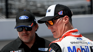 NASCAR Cup Series driver Kevin Harvick (4) talks with one of his team owners Tony Stewart on Sunday, Aug. 13, 2023, ahead of the Verizon 200 at the Brickyard at Indianapolis Motor Speedway.