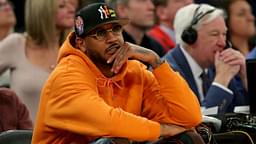 New York Knicks former player Carmelo Anthony sits courtside during the second half between the Villanova Wildcats and the Georgetown Hoyas at Madison Square Garden.