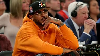 New York Knicks former player Carmelo Anthony sits courtside during the second half between the Villanova Wildcats and the Georgetown Hoyas at Madison Square Garden.