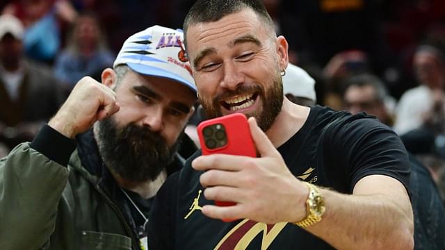 Mar 5, 2024; Cleveland, Ohio, USA; Cleveland natives and NFL players Travis, right, and Jason Kelce celebrate after the Cleveland Cavaliers beat the Boston Celtics during the second half at Rocket Mortgage FieldHouse.