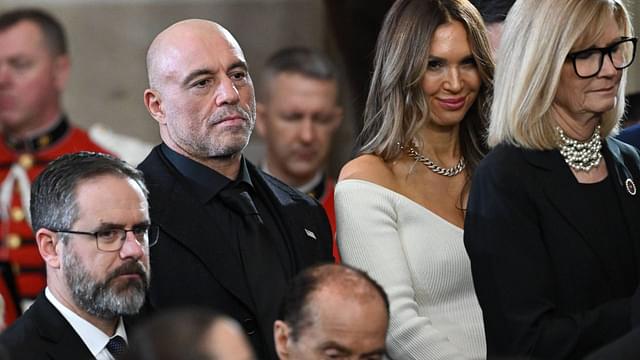 US media personality Joe Rogan stands for a benediction after President Donald Trump was sworn in as the 47th US President in the US Capitol Rotunda in Washington
