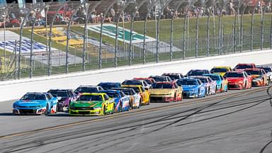 NASCAR Cup Series drivers William Byron (24) and Austin Cindric (2) battle for the lead late during stage three of the NASCAR: Jack Link's 500 at Talladega Superspeedway.