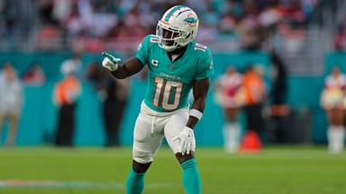 Miami Dolphins wide receiver Tyreek Hill (10) signals from the line of scrimmage against the San Francisco 49ers during the second quarter at Hard Rock Stadium.