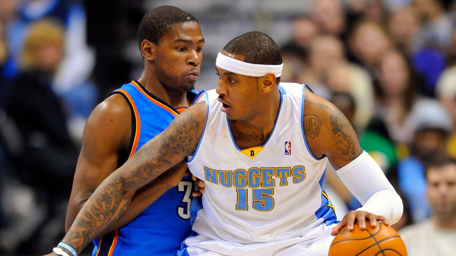 Dec 14, 2009; Denver, CO, USA; Oklahoma City Thunder forward Kevin Durant guards Denver Nuggets forward Carmelo Anthony (15) in the second half at the Pepsi Center.
