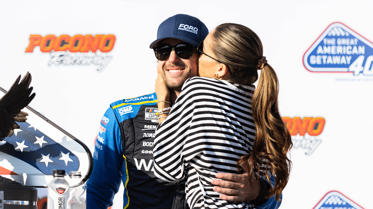 Ryan Blaney (12) gets a kiss from fiancé Gianna Tulio after winning the NASCAR Cup Series on July 14, 2024