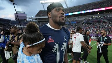 NFC defensive end Micah Parson of the Dallas Cowboys (11) holds his daughter Shatara Parsons after the 2025 Pro Bowl Games at Camping World Stadium.
