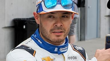 Arrow McLaren driver Kyle Larson (17) takes a selfie with a fan Tuesday, May 13, 2025, during a practice for the 109th running of the Indianapolis 500 at Indianapolis Motor Speedway.