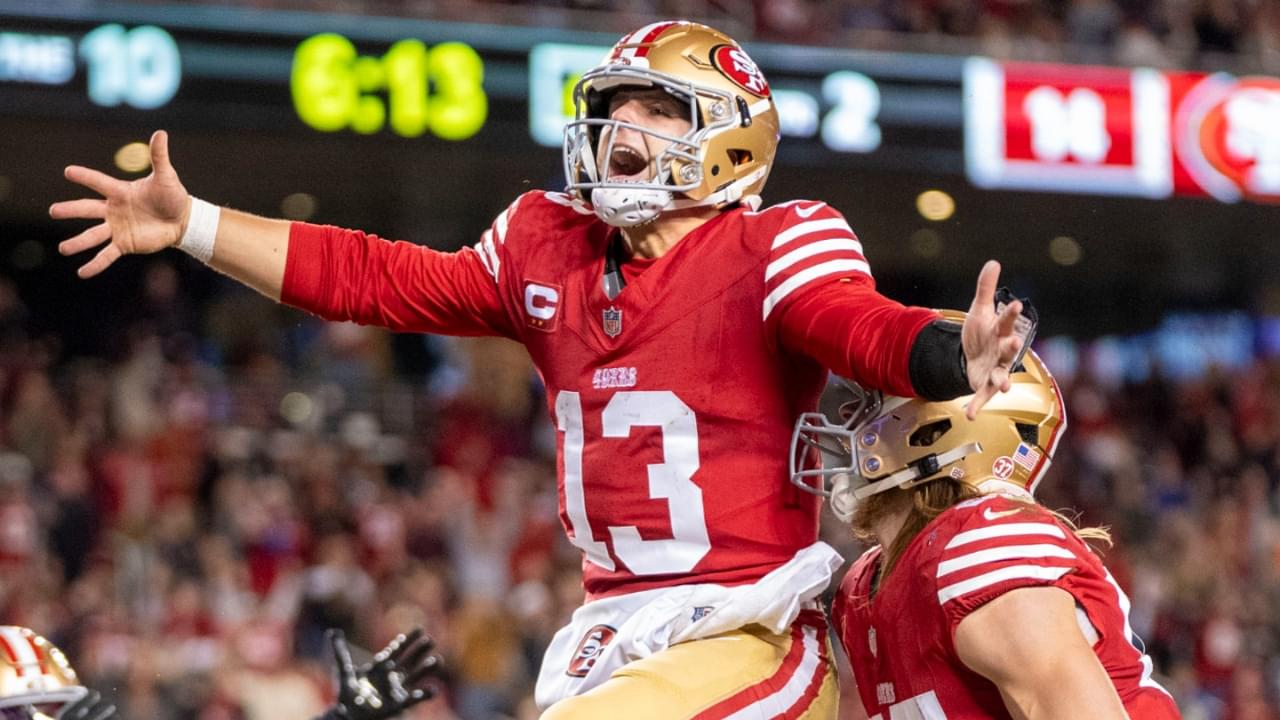 December 30, 2024; Santa Clara, California, USA; San Francisco 49ers quarterback Brock Purdy (13) celebrates with tight end George Kittle (85) after scoring a touchdown against the Detroit Lions during the second quarter at Levi's Stadium.