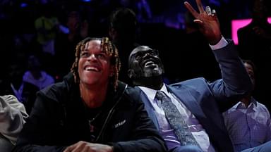 Shaquille O'Neal sits with his son Shareef O'Neal during the fourth quarter of the game between the New Orleans Pelicans and the Los Angeles Lakers in the NBA In Season Tournament Semifinal at T-Mobile Arena
