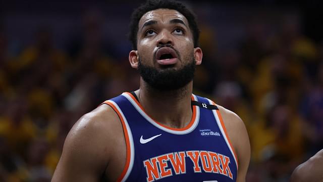 May 27, 2025; Indianapolis, Indiana, USA; New York Knicks center Karl-Anthony Towns (32) looks up at a scoreboard during the third quarter against the Indiana Pacers of game four of the eastern conference finals for the 2025 NBA Playoffs at Gainbridge Fieldhouse