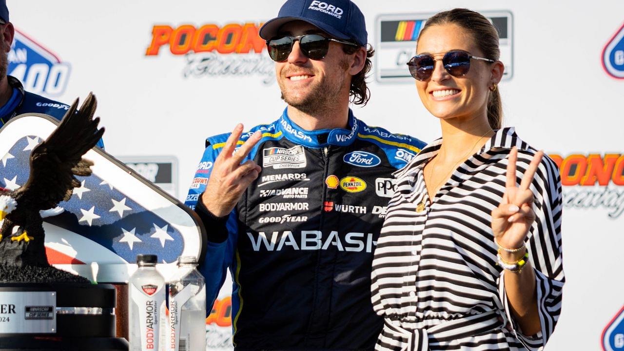 Team Penske's Ryan Blaney (12) poses with his fiancé Gianna Tulio on July 14, 2024