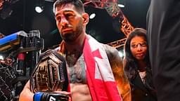 ; Ilia Topuria celebrates his championship victory against Alexander Volkanovski during UFC 298 at Honda Center.
