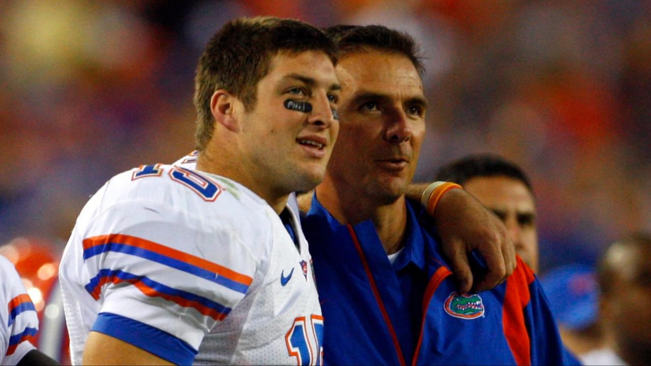 Florida Gators head coach Urban Meyer and quarterback Tim Tebow (15) hug each other against the Georgia Bulldogs against the Georgia Bulldogsduring the second half at Jacksonville Municipal Stadium. Gators won 49- 10.