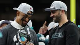 Philadelphia Eagles quarterback Jalen Hurts holds the Lombardi Trophy while standing next to Eagles head coach Nick Sirianni (R) during the championship trophy presentation after the Eagles' game against the Kansas City Chiefs in Super Bowl LIX at Caesars Superdome.