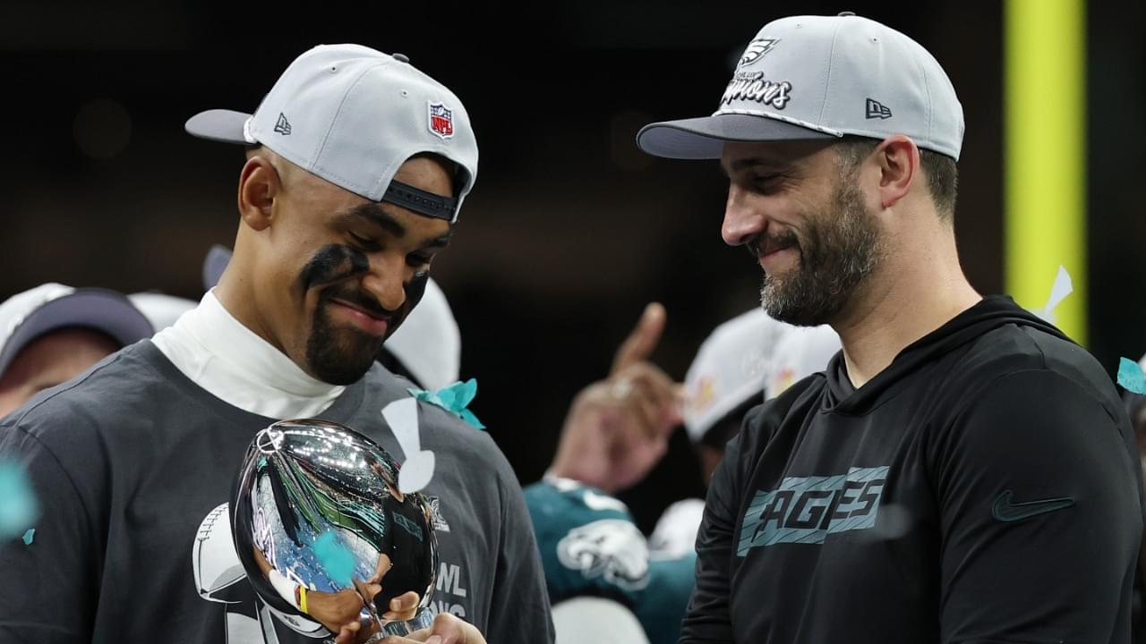 Philadelphia Eagles quarterback Jalen Hurts holds the Lombardi Trophy while standing next to Eagles head coach Nick Sirianni (R) during the championship trophy presentation after the Eagles' game against the Kansas City Chiefs in Super Bowl LIX at Caesars Superdome.