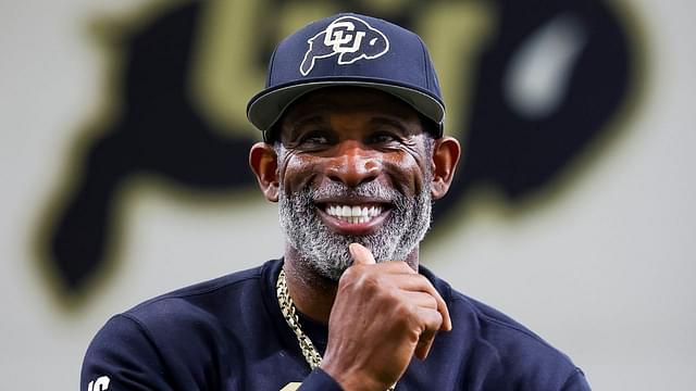 Colorado Buffaloes head coach Deion Sanders watches as his players go through drills at the University of Colorado NFL Showcase at the CU Indoor Practice Facility.