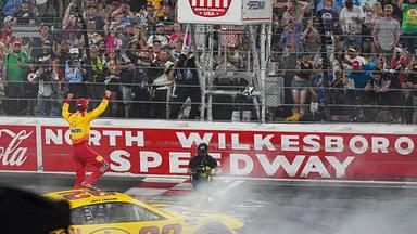 NASCAR Cup Series driver Joey Logano (22) reacts to his win to the fans during the All Star race at North Wilkesboro Speedway.