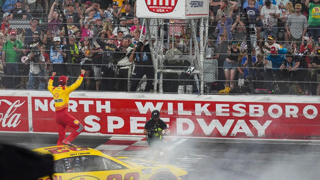 NASCAR Cup Series driver Joey Logano (22) reacts to his win to the fans during the All Star race at North Wilkesboro Speedway.