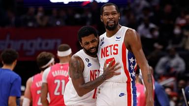 Brooklyn Nets guard Kyrie Irving (11) celebrates with Nets forward Kevin Durant (7) against the Washington Wizards in the fourth quarter at Capital One Arena.