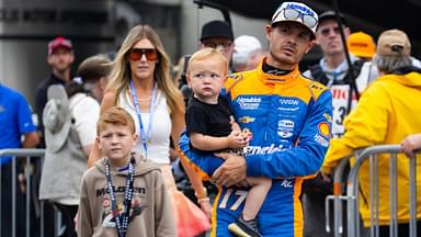 Indycar Series driver Kyle Larson holds son Cooper Larson as he walks with wife Katelyn Larson and son Owen Larson prior to the 108th running of the Indianapolis 500 at Indianapolis Motor Speedway.