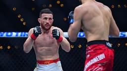 Merab Dvalishvili (red gloves) fights Umar Nurmagomedov (blue gloves) during UFC 311 at Intuit Dome.