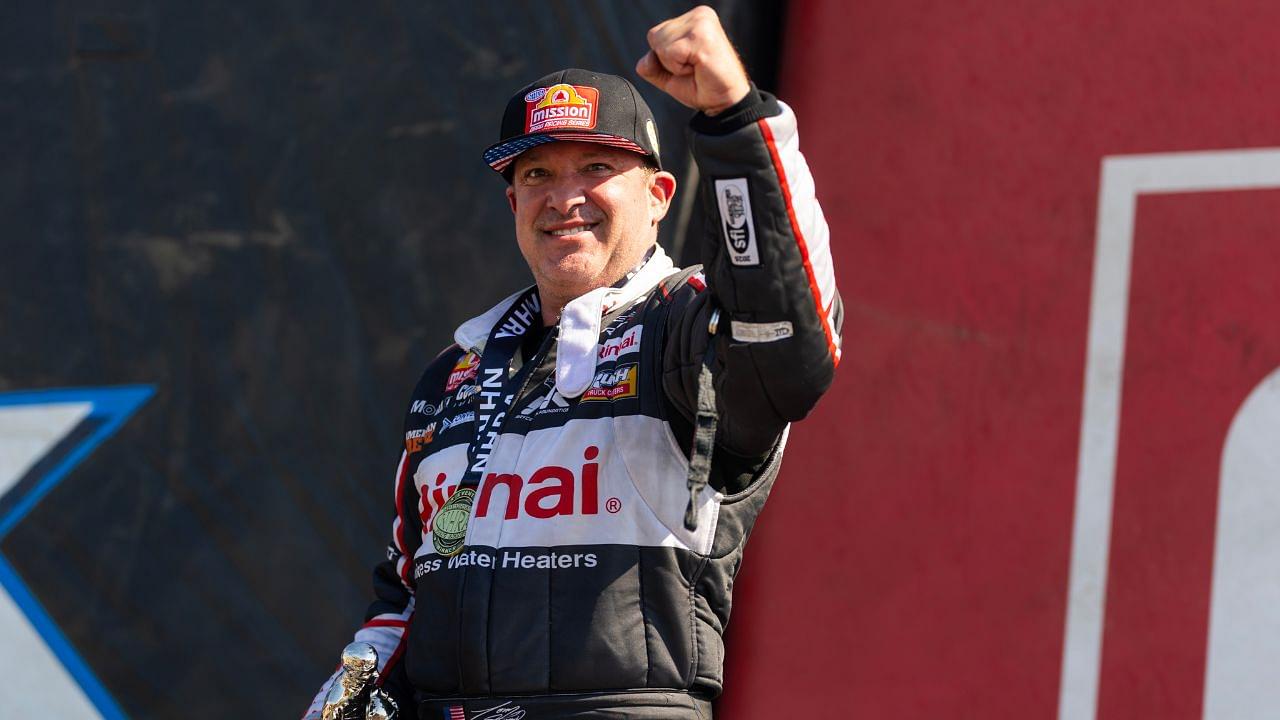 NHRA top fuel driver Tony Stewart celebrates after winning the Route 66 Nationals at Route 66 Raceway.