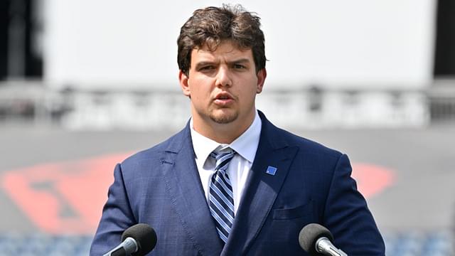 New England Patriots first round draft pick Will Campbell addresses media during a press conference on the game field at Gillette Stadium.