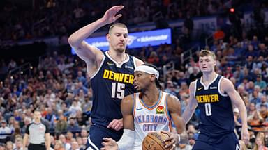 Mar 10, 2025; Oklahoma City, Oklahoma, USA; Denver Nuggets center Nikola Jokic (15) defends a drive by Oklahoma City Thunder guard Shai Gilgeous-Alexander (2) during the second half at Paycom Center. Mandatory Credit: Alonzo Adams-Imagn Images