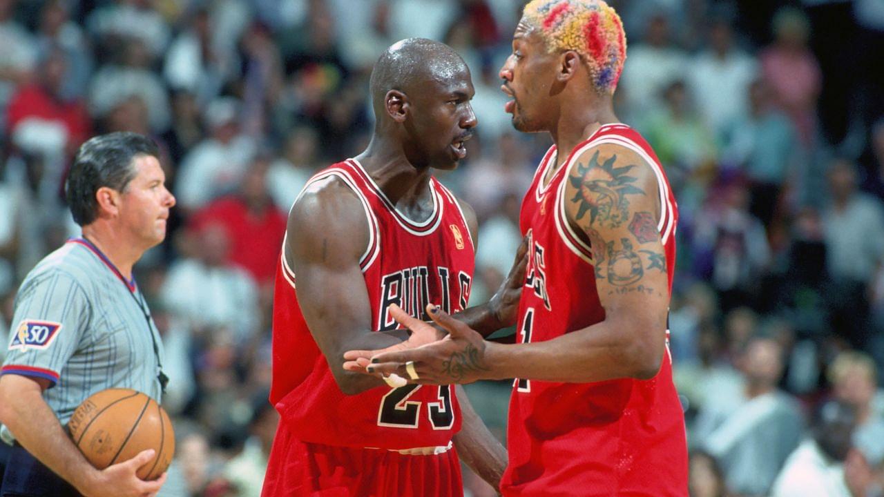 Chicago Bulls forward #91 DENNIS RODMAN is held back from the official by guard #23 MICHAEL JORDAN against the Miami Heat at the Miami Arena during the 1996-97 season.