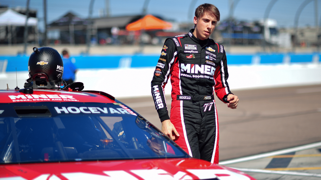 Mar 8, 2025; Avondale, AZ, USA; NASCAR Cup Series driver Carson Hocevar (77) during qualifying for the Shrines Children’s 500 at Phoenix Raceway. Mandatory Credit: Gary A. Vasquez-Imagn Images