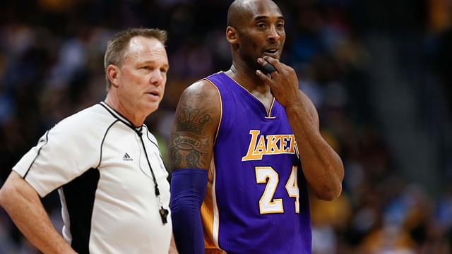 Mar 2, 2016; Denver, CO, USA; Los Angeles Lakers forward Kobe Bryant (24) talks with referee Bill Spooner (22) in the first quarter of the game against the Denver Nuggets at the Pepsi Center.