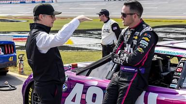 Former NASCAR driver Jeff Gordon visits pit row to talk with NASCAR Cup Series driver Alex Bowman (48) before the 2023 YellaWood 500 at Talladega Superspeedway.