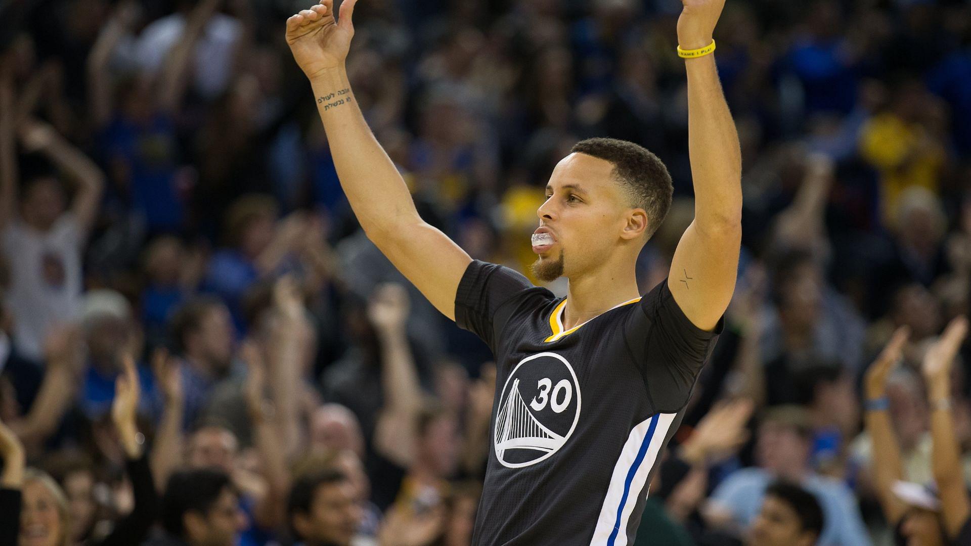 Mar 12, 2016; Oakland, CA, USA; Golden State Warriors guard Stephen Curry (30) gestures to the fans after a three point basket against the Phoenix Suns during the fourth quarter at Oracle Arena