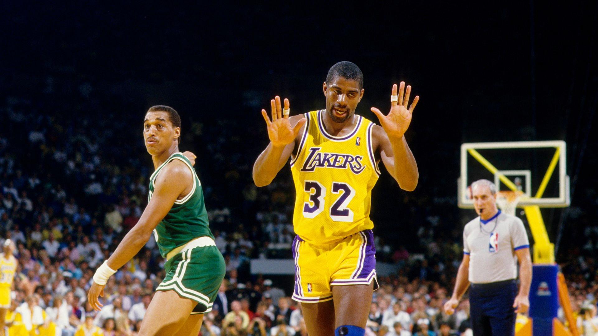 Unknown date; Los Angeles, CA, USA; FILE PHOTO; Los Angeles Lakers guard Magic Johnson (32) reacts as Boston Celtics guard Dennis Johnson points at The Forum. Mandatory