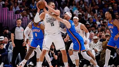 Denver Nuggets center Nikola Jokic (15) controls the ball under pressure form Oklahoma City Thunder guard Alex Caruso (9) in the second quarter during game six of the second round for the 2025 NBA Playoffs at Ball Arena.