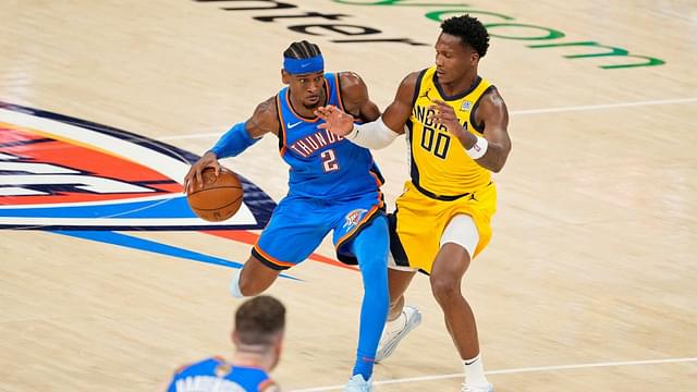 Oklahoma City Thunder guard Shai Gilgeous-Alexander (2) dribbles the ball against Indiana Pacers guard Bennedict Mathurin (00) during the second half during game two of the 2025 NBA Finals at Paycom Center.