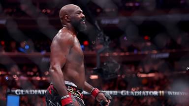 Jon Jones (red gloves) reacts after defeating Stipe Miocic (not pictured) in the heavyweight bout during UFC 309 at Madison Square Garden