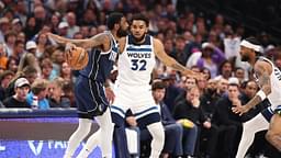 Dallas Mavericks guard Kyrie Irving (11) dribbles against Minnesota Timberwolves center Karl-Anthony Towns (32) during the first quarter of game four of the western conference finals for the 2024 NBA playoffs at American Airlines Center
