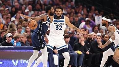 Dallas Mavericks guard Kyrie Irving (11) dribbles against Minnesota Timberwolves center Karl-Anthony Towns (32) during the first quarter of game four of the western conference finals for the 2024 NBA playoffs at American Airlines Center