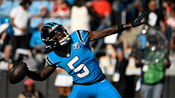 Carolina Panthers wide receiver Diontae Johnson (5) celebrates by throwing the ball into the crowd after scoring a thouchdown