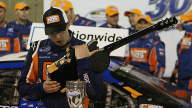 Kyle Busch smashes a Gibson guitar in Victory Lane at 14th Annual Federated Auto Parts 300 to be held June 6 at the Nashville Speedway in Gladeville, Tenn on June 6,2009.