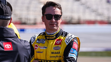 Feb 25, 2024; Hampton, Georgia, USA; NASCAR Cup Series driver Christopher Bell (20) on pit road prior to qualifying for the Ambetter Health 400 at Atlanta Motor Speedway. Mandatory Credit: David Yeazell-Imagn Images