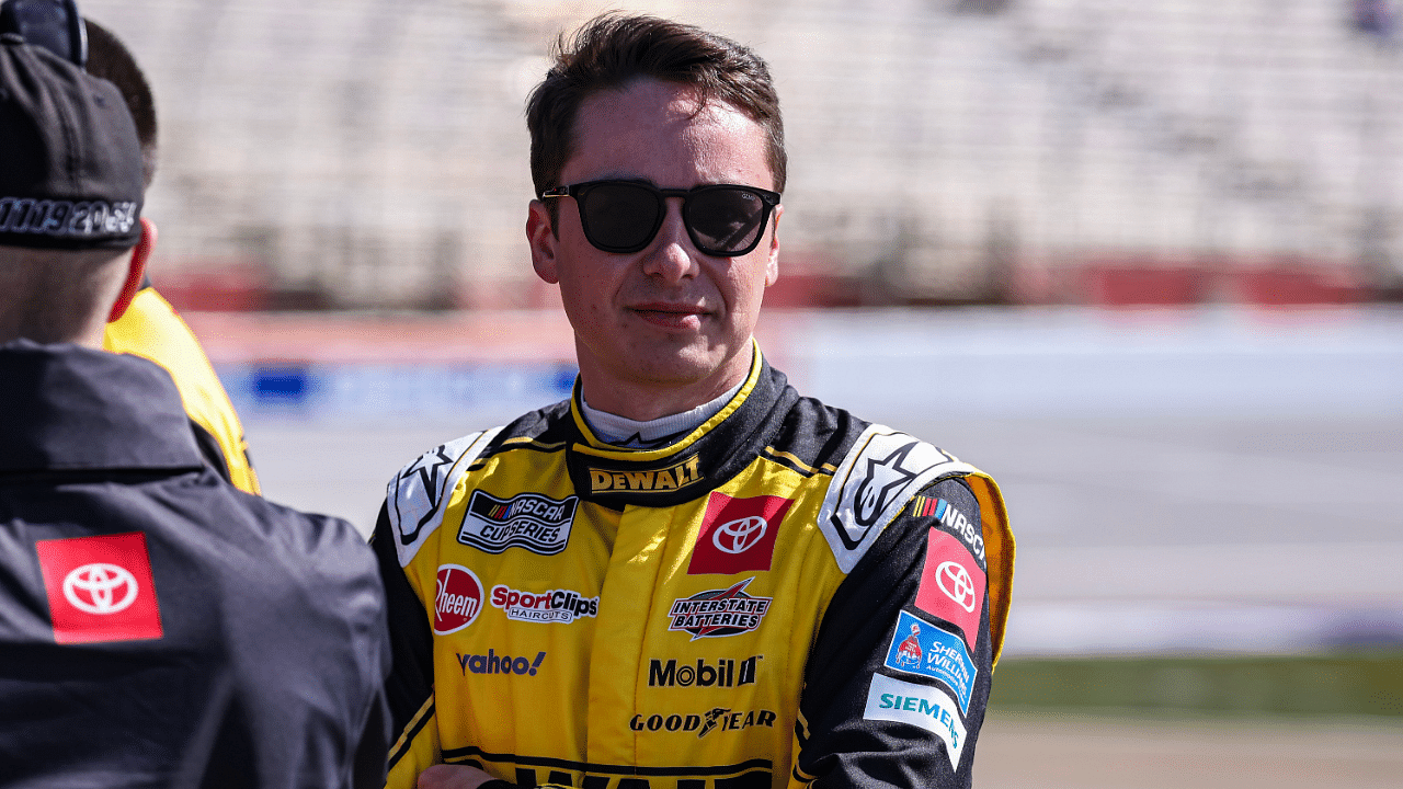Feb 25, 2024; Hampton, Georgia, USA; NASCAR Cup Series driver Christopher Bell (20) on pit road prior to qualifying for the Ambetter Health 400 at Atlanta Motor Speedway. Mandatory Credit: David Yeazell-Imagn Images