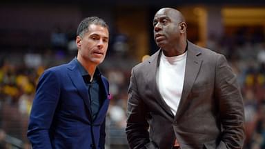 Los Angeles Lakers general manager Rob Pelinka speaks with president of basketball operations Magic Johnson at Honda Center.
