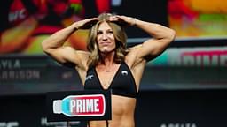 Kayla Harrison steps on the scale for the ceremonial weigh-ins at the Salt Palace Convention Center for UFC307