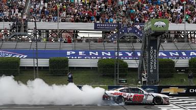 NASCAR Xfinity Series driver Cole Custer (00) celebrates after winning the Explore The Pocono Mountains 225 at Pocono Raceway.